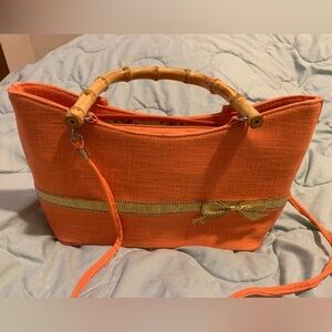 Satchel with bamboo too handle